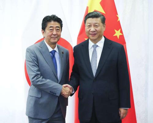 Chinese President Xi Jinping and Japanese Prime Minister Shinzo Abe meet in Vladivostokon, Sept. 12, 2018. (Photo/Xinhua)