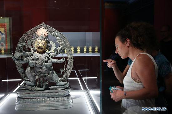 A bronze statuette of Mahakala is seen at the exhibition titled 