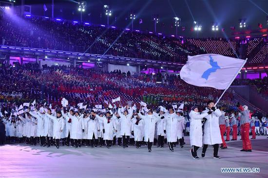 The Democratic People's Republic of Korea (DPRK) and the Republic of Korea (ROK) marched together under a unified Korean flag during the opening ceremony of the 2018 Pyeongchang Winter Olympic Games at Pyeongchang Olympic Stadium in Pyeongchang, the ROK, Feb. 9, 2018. (Photo/Xinhua)