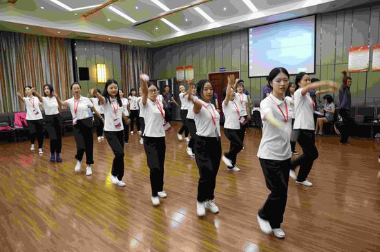 The youngsters do rehearsal before they set off to Russia. (CGTN Photo)