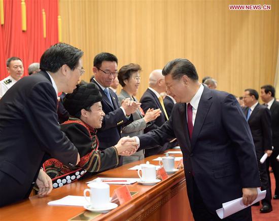 Chinese President Xi Jinping, also general secretary of the Communist Party of China (CPC) Central Committee and chairman of the Central Military Commission, shakes hands with delegates to the seventh national congress of the China Disabled Persons' Federation in Beijing, capital of China, on Sept. 14, 2018. The congress opened in Beijing Friday. (Xinhua/Li Xueren)