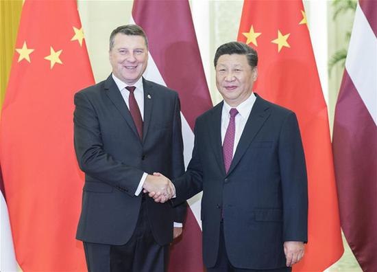 Chinese President Xi Jinping meets with his Latvian counterpart Raimonds Vejonis at the Great Hall of the People in Beijing, capital of China, Sept. 18, 2018. Raimonds Vejonis is in China to attend the Summer Davos Forum in north China's Tianjin. (Xinhua/Huang Jingwen)