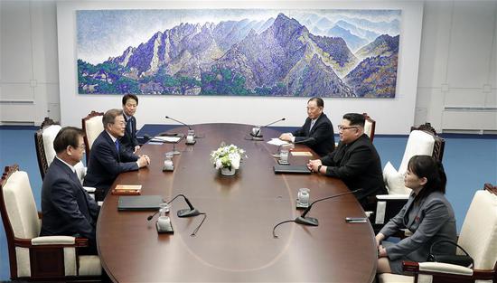 ROK President Moon Jae-in, second left, meets with top leader of the DPRK Kim Jong-un, second right, at the Peace House, a building on the ROK side of Panmunjom on April 27, 2018. (Photo/Xinhua)