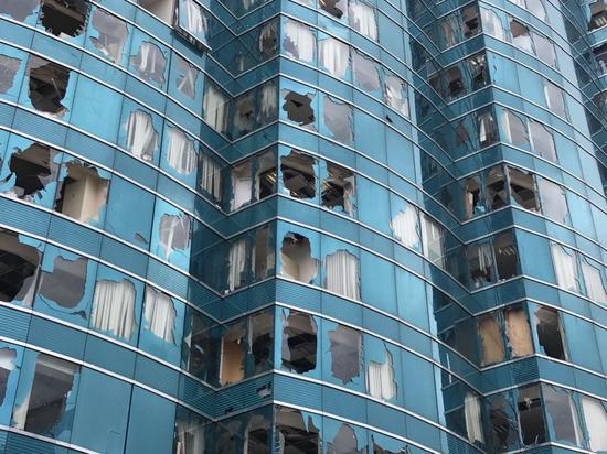 Windows of an office building were battered by the typhoon. /CGTN Photo