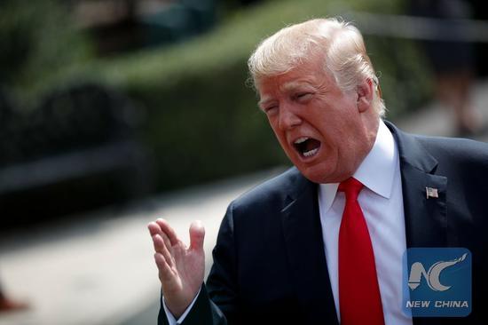 File photo: U.S. President Donald Trump speaks to reporters before leaving the White House in Washington D.C., the United States, Aug. 17, 2018. (Xinhua/Ting Shen)