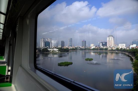 Photo taken in the carriage of Vietnam's first urban railway shows a landscape of Hanoi,Vietnam, on Sept. 20, 2018. (Xinhua/Ngo Minh Tien)