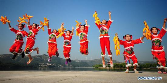 Girls perform in an activity marking China's first Farmers' Harvest Festival in Zibo, east China's Shandong Province, Sept. 23, 2018. People across China hold various activities to celebrate the country's first Farmers' Harvest Festival, which falls on Sept. 23 this year. (Xinhua/Liu Bingyou)