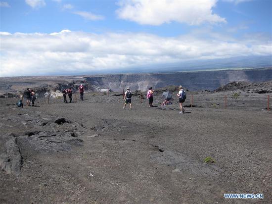 People tour Hawaii Volcanoes National Park in Hawaii, the United States, Sept. 22, 2018. Hawaii Volcanoes National Park located in the U.S. Pacific island state of Hawaii reopened Saturday morning after being closed for 134 days due to the eruption of Kilauea volcano. (Xinhua/Chen Bing)