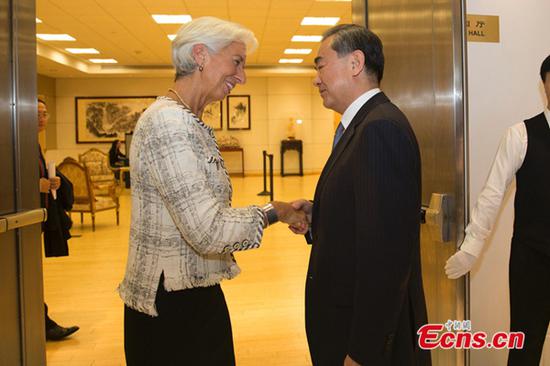 Chinese State Councilor and Foreign Minister Wang Yi (R) meets with Managing Director of the International Monetary Fund (IMF) Christine Lagarde in New York, the United States, on Sept. 26, 2018. (Photo: China News Service/Liao Pan)