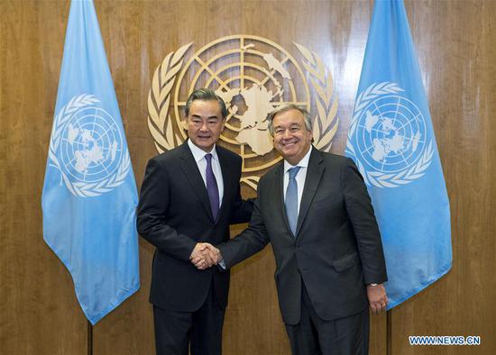 Chinese State Councilor and Foreign Minister Wang Yi (L) meets with UN Secretary-General Antonio Guterres, in New York, on Sept. 27, 2018. (Xinhua/Wang Ying)