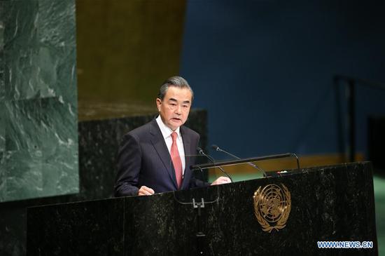 Chinese State Councilor and Foreign Minister Wang Yi addresses the General Debate of the 73rd session of the United Nations General Assembly at the UN headquarters in New York, on Sept. 28, 2018. Wang Yi on Friday delivered a speech at the General Debate of the UN General Assembly, endorsing multilateralism, world peace and free trade. (Xinhua/Qin Lang)