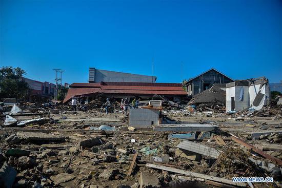 Photo taken on Oct. 1, 2018 show debris of buildings in Palu after the deadly earth quake and tsunami in Central Sulawesi, Indonesia. Over 1,203 people were killed in Palu, Donggala district, Parigi Mountong district and North Mamuju district, according to the Disaster Management Institute of Indonesia, Care for Humanity and the Humanity Data Center. (Xinhua/Iqbal Lubis)