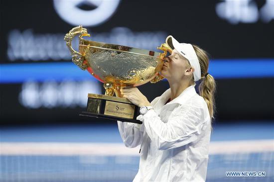 Caroline Wozniacki of Denmark kisses the trophy during the awarding ceremony of the women's singles event at the China Open tennis tournament in Beijing, capital of China, on Oct. 7, 2018. (Xinhua/Jia Haocheng)