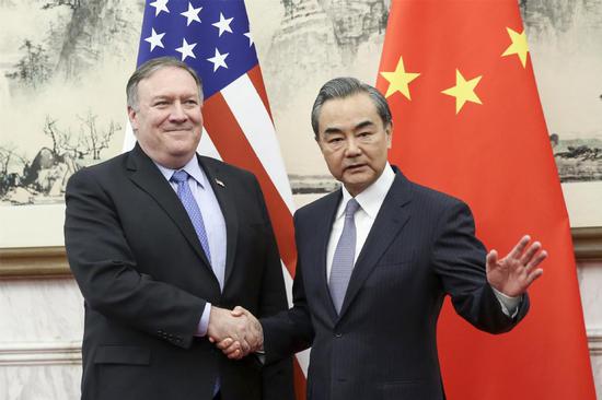 Chinese State Councilor and Foreign Minister Wang Yi meets with US Secretary of State Mike Pompeo in Beijing on Oct 8, 2018. (Photo by Feng Yongbin/China Daily)