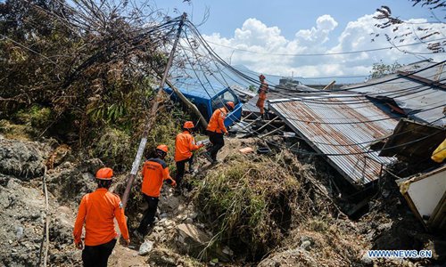 People search for victims on the debris of houses in Petobo village after earthquake and tsunami in Central Sulawesi, Indonesia, on Oct. 2, 2018. (Xinhua/Iqbal Lubis)