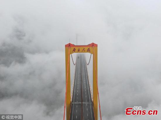 Enormous Puli Bridge swallowed by clouds