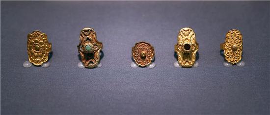 Gold rings unearthed from the Tomb of Chenguo Princess of Liao are part of more than 270 or so relics of the Qidan nomadic ethnic tribe, which established the Liao Dynasty, on display at an ongoing exhibition at Beijing's Capital Museum. The show runs through Dec. 9. (Photo by Zou Hong/China Daily)