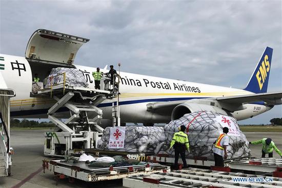 The first batch of humanitarian supplies from the Chinese government for Indonesia's quake victims arrives at Balikpapan International Airport in eastern Kalimantan Island, Indonesia, on Oct. 9, 2018. (Xinhua)