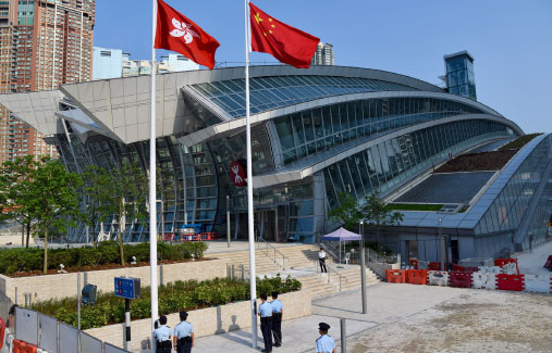 The national and Hong Kong SAR flags flutter outside the Hong Kong's West Kowloon Station. [Photo provided to China Daily]