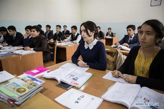 Students take Chinese language lesson at the Confucius Institute of the Tajik National University for Nationalities in Dushanbe, Tajikistan, on Oct. 10, 2018. (Xinhua/Wu Zhuang)