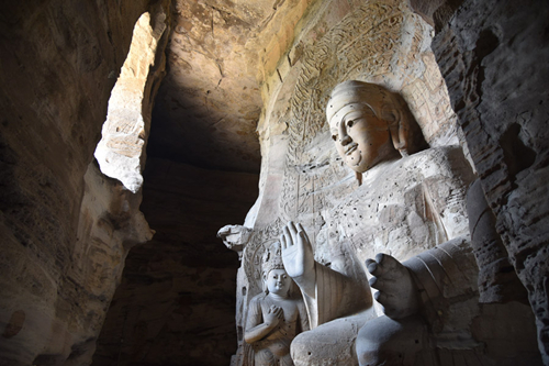 Yungang Grottoes are a cradle of Buddhist art, playing host to more than 51,000 sculptures. (Photo by Zhang Xingjian/chinadaily.com.cn)