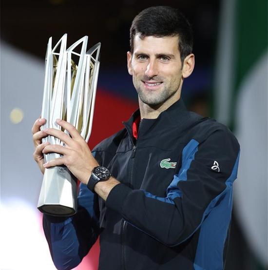 Novak Djokovic of Serbia poses with the trophy during the awarding ceremony of the men's singles event at 2018 ATP Shanghai Masters tennis tournament in Shanghai, east China, Oct. 14, 2018. Novak Djokovic won 2-0 in the final and claimed the title of the event. (Xinhua/Ding Ting)