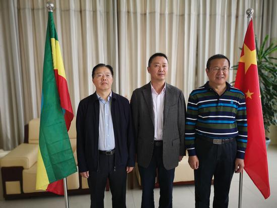 Managers of the Eastern Industrial Zone (from left) Tao Huixing, Lu Qizhong and Jiao Yongshun.  (Photo by Xiao Xiangyi/China Daily)