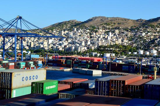 MV Cosco Netherlands, a giant container ship carrying Chinese-made commodities, arrives at Piraeus Port in Greece in August. (Photo by Jiang Chenglong/China Daily)