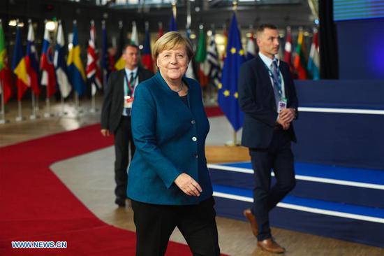 German Chancellor Angela Merkel (front) arrives at the European Council in Brussels, Belgium, Oct. 17, 2018. The current status of the Brexit negotiations will be the key issue at the EU summit on Wednesday evening. British Prime Minister Theresa May is expected to explain to heads of state of the 27 EU members how she envisages a solution to the remaining questions regarding Brexit. (Xinhua/Zheng Huansong)