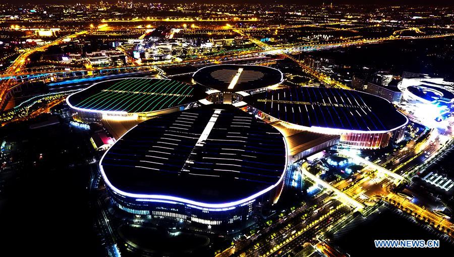 Aerial photo taken on Oct. 19, 2018 shows a night view of the National Exhibition and Convention Center (Shanghai), the main venue to held the upcoming first China International Import Expo (CIIE), scheduled to be held from Nov. 5 to 10, in Shanghai, east China. (Xinhua/Fan Jun)