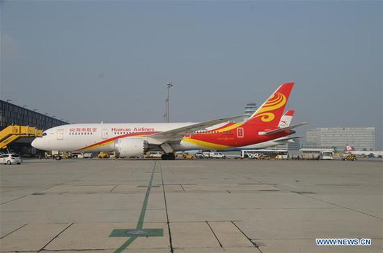 A Boeing 787 Dreamliner of Hainan Airlines arrives at the Vienna International Airport in Vienna, Austria, on Oct. 20, 2018. A direct flight of China's Hainan Airlines between southern Chinese city of Shenzhen and the Austrian capital Vienna was launched on Saturday, with the landing of its first aircraft here at the Vienna International Airport. (Xinhua/Liu Xiang)