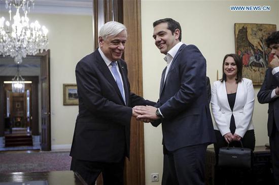 Greek Prime Minister Alexis Tsipras (R, Front) shakes hands with Greek President Prokopis Pavlopoulos at the presidential office in Athens, Greece, on Oct. 20, 2018. Alexis Tsipras was sworn in as Greece's Foreign Minister before Greek President Prokopis Pavlopoulos on Saturday, officially taking over the helm of the ministry from Nikos Kotzias, who resigned on Wednesday. (Xinhua/Giorgos Kontarinis) 