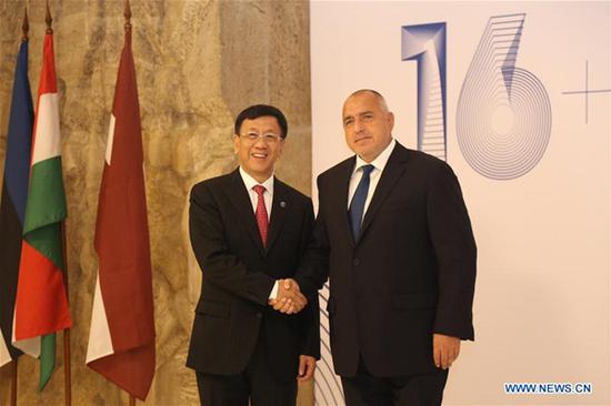 Cao Jianming (L), vice chairman of the Standing Committee of China's National People's Congress, shakes hands with Bulgarian Prime Minister Boyko Borissov during their meeting in Sofia, capital of Bulgaria, on Oct. 20, 2018. At the 4th Local Leaders' Meeting of China and CEEC, Cao Jianming said that in recent years the 16+1 cooperation has achieved very good results at the local level. (Xinhua/Wang Xinran)