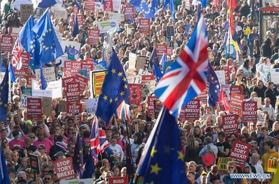 People take part in the People's Vote March in London, Britain, on Oct. 20, 2018. Nearly 700,000 people marched in London on Saturday afternoon demanding a second Brexit referendum. (Xinhua/Ray Tang)