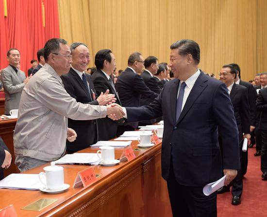 President Xi Jinping, also general secretary of the Communist Party of China Central Committee and chairman of the Central Military Commission, shakes hands with delegates to the 17th National Congress of the All-China Federation of Trade Unions in Beijing, Oct. 22, 2018. (Photo/Xinhua)