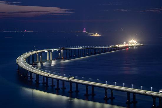 The Hong Kong-Zhuhai-Macao Bridge and tunnel seen on Sunday, as final preparations were made for its opening on Wednesday. (Photo by Vincent Chan/ for China Daily)