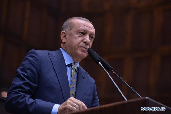 Turkish President Recep Tayyip Erdogan delivers a speech during the parliamentary group meeting of the ruling Justice and Development Party in Ankara, Turkey, on Oct. 23, 2018. Turkish President Recep Tayyip Erdogan said on Tuesday that Saudi journalist Jamal Khashoggi's murder at the Saudi consulate in Istanbul was 