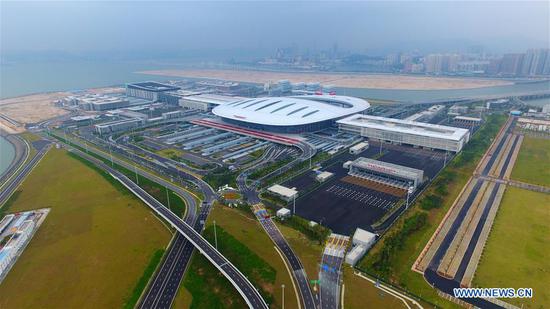 Aerial photo taken on Oct. 24, 2018 shows the Zhuhai Port of the Hong Kong-Zhuhai-Macao Bridge in Zhuhai, south China's Guangdong Province. The bridge officially opened to traffic at 9 a.m. on Oct. 24. (Xinhua/Liang Xu)