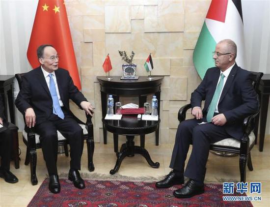 hinese Vice President Wang Qishan(left) meets with Palestinian Prime Minister Rami Hamdallah in Ramallah, Palestine, October 23 2018. [Photo:Xinhua]