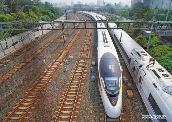 The G7 Fuxing bullet train departs the Beijing South Railway Station in Beijing, capital of China, July 1, 2018.(Photo/Xinhua)