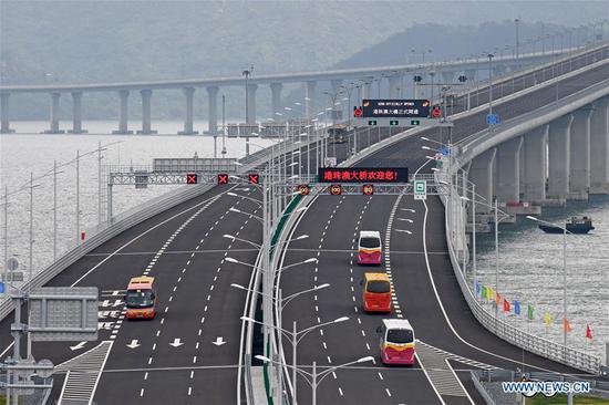 Cars run on the Hong Kong-Zhuhai-Macao Bridge, Oct. 24, 2018. The Hong Kong-Zhuhai-Macao bridge, the world's longest cross-sea bridge, opened to public traffic at 9 a.m. Wednesday. (Xinhua/Liang Xu)