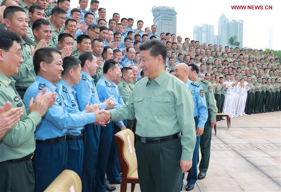 Chinese President Xi Jinping, also general secretary of the Communist Party of China Central Committee and chairman of the Central Military Commission, shakes hands with military officers as he inspects the Southern Theater Command of the People's Liberation Army, Oct. 25, 2018. (Xinhua/Li Gang)