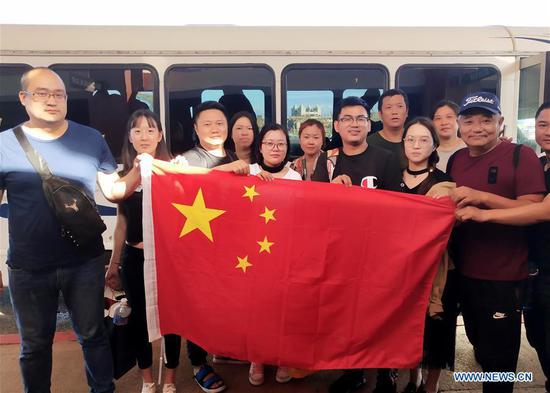 Typhoon-trapped Chinese tourists start to fly back home from Saipan 