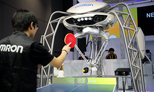 This robot produced by Japan's Omron plays ping pong. (Photo: Yang Hui/ GT)