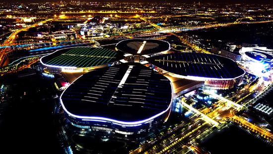 The National Exhibition and Convention Center in Shanghai lights up the night sky. (Photo/Xinhua)