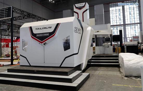 A Taurus milling machine from German Waldrich Coburg is adjusted at the National Exhibition and Convention Center in Shanghai, east China, on Oct. 30, 2018. (Xinhua/Fang Zhe)