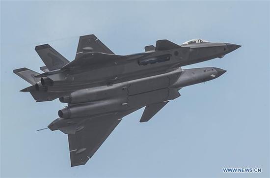An echelon of J-20 fighters are seen at the 12th China International Aviation and Aerospace Exhibition (Airshow China) in Zhuhai, south China's Guangdong Province, Nov. 11, 2018, commemorating the 69th anniversary of the People's Liberation Army Air Force. (Xinhua/Liu Yinghua)