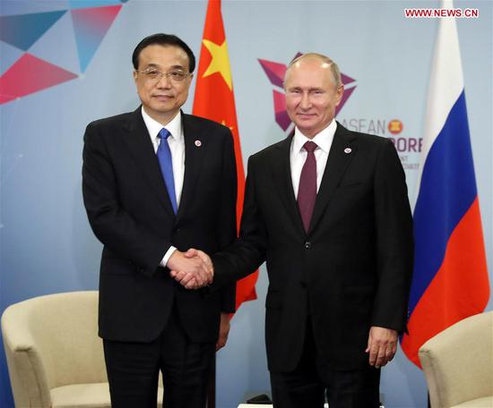 Chinese Premier Li Keqiang meets with Russian President Vladimir Putin in Singapore, on Nov. 15, 2018. (Xinhua/Liu Weibing)