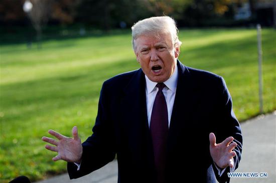 U.S. President Donald Trump speaks to reporters before departing from the White House in Washington D.C., the United States, on Nov. 20, 2018. Donald Trump has submitted written answers to questions from Special Counsel Robert Mueller probing into the alleged Russian meddling in the 2016 U.S. elections, local media on Tuesday quoted the president's attorneys as saying. (Xinhua/Ting Shen)