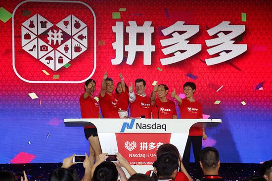 Company executives of Pinduoduo celebrate as the company gets listed on the Nasdaq on July 26. (Provided to China Daily)